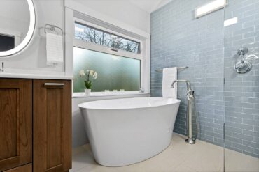 Freestanding soaking tub with heated back and air jets by BainUltra with floor- mounted roman tub filler by Moen — design by McCabe By Design (Photo courtesy Tammy Dwight)