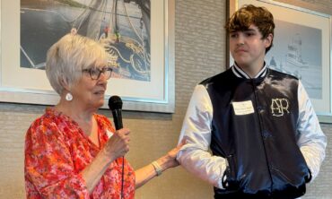 Marilyn Colyar, Heron's Key scholarship group leader, with Bobby Ward-Mack, a Henderson Bay High School graduating senior who will attend Evergreen State University. Heron's Key has pledged to support him throughout his college experience as long as he maintains his academic record.