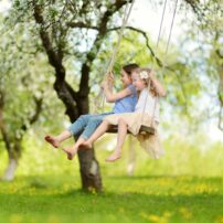 kids playing swinging