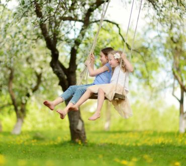 kids playing swinging