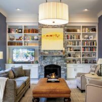 Family room custom cabinetry and bookcases and Mendota fireplace with bluestone surround