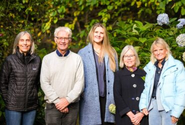 Chalet in the Woods owner Laura Almaas, (fourth from the left) with one of her shop assistants (far left) and visitors from Norway who produce a line of jewelry she has carried for over 30 years.