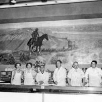 Left to right: Betty, sister; Elma, sister; Harry, brother; George, founder; Harold Minder, brother; Jim Minder, brother Photo taken at Minder Meats/Silverdale Co-Op, 1959