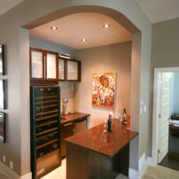 Many amenities were included in this efficient, tucked-away bar by Natalia Pierce, CMKBD, of Detail By Design