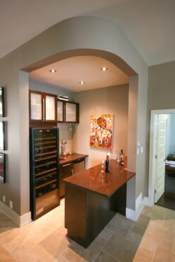 Many amenities were included in this efficient, tucked-away bar by Natalia Pierce, CMKBD, of Detail By Design