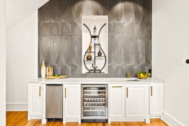 A one-wall bar with ice, refrigeration, sink and storage — Designer Sunita Ritesh with Mechkithh Designs (Photo courtesy Dallas Real Estate Photography)