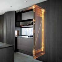 Blum Revego bi-fold door that pockets into a 4.5-inch-wide cavity, allowing seamless concealment when closed and full access when open