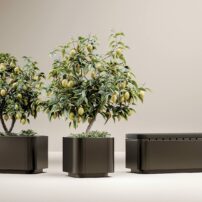 The Ascento grilling island has several unique coordinating pieces such as these planters and storage bench.