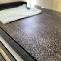 EcoDomo recycled leather closet shelf liner in pebble shagree in conjunction with Kesseböhmer