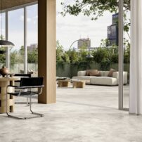 Bringing the outdoors in with the same tile in different surface finishes — deco and large- format porcelain tiles from the Elements Collection in white by Del Conca USA