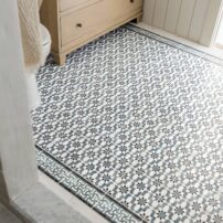 Suitable for light-traffic residential applications, the made-to-order Miabella motif on Carrara marble in Stone Impressions’ Seaglass finish, with a coordinating border tile
