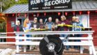 Bainbridge Island Deputy Mayor Jon Quitslund cuts the “ribbon” opening the new store alongside Rockin’ Ruby’s owners Melanie Peters, Jill Paisley, Stefan Goldby and Christine Goldby.