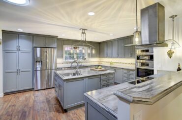 "I can't believe it's laminate!" The natural stone look and the ogee style edge belies the fact that this is, indeed, laminate. Design by McCabe By Design LLC (Photography courtesy Iklil Gregg)