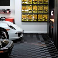 THE VINTAGE TOUCH: About a decade ago, while antiquing with his high school sweetheart — now his wife — Johnson came across two worn, yellowed vintage racing posters. That discovery sparked the collection you now see displayed on the wall.