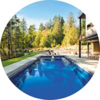 JUMP IN The Latham Pools pool and firepits were installed by 4 Seasons Landscaping. The concrete around the pool is by Olive Concrete.