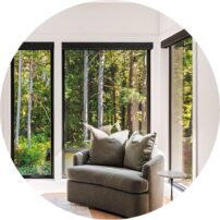 READING NOOK This lovely corner of the primary suite is the perfect place to unwind. We love the natural light of the tall Milgard Windows.