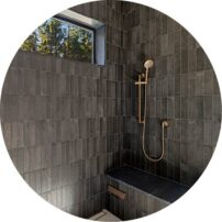 SHOWER POWER The tile continues into the spacious and luxurious shower. We love the built-in seating and the natural light from the window that still offers privacy.